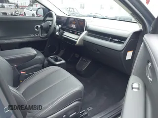 2024 Hyundai Ioniq 5 Limited z VIN KM8KR4DE4RU310424, wystawiony jako IAAI lot #41761478 z przebiegiem 4 027 mil mil oraz . Historia ofert i sprzedaży dostępna na DreamBid. Obrazek 5.