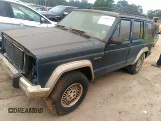 1993 Jeep Cherokee Country with VIN 1J4FJ78S0PL519025, listed as a IAAI auction lot 42409707 with 162,231 mi miles and . Bid and sale history available at DreamBid. Image 2.