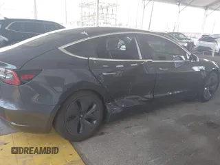 2020 Tesla Model 3 Standard Range Plus with VIN 5YJ3E1EA8LF743405, listed as a IAAI auction lot 41923592 with 81,901 mi miles. Bid and sale history available at carsss.com. Image 6.