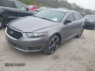 2014 Ford Taurus SHO with VIN 1FAHP2KT0EG171336, listed as a IAAI auction lot 41566688 with 154,328 mi miles. Bid and sale history available at carsss.com. Image 17.