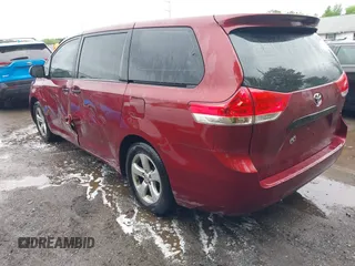 2014 Toyota Sienna L with VIN 5TDZK3DC0ES457242, listed as a IAAI auction lot 42307360 with 86,857 mi miles and . Bid and sale history available at DreamBid. Image 3.