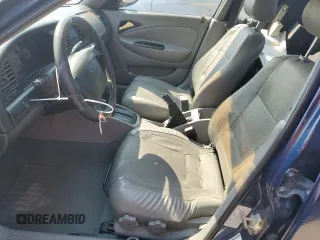 2001 Daewoo Nubira CDX z VIN KLAJB52Z31K647237, wystawiony jako Copart lot #69299834 z przebiegiem 51 513 mil mil oraz Szkody całkowita. Historia ofert i sprzedaży dostępna na DreamBid. Obrazek 7.