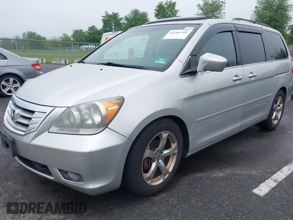 2009 Honda Odyssey Touring with VIN 5FNRL38859B029714, listed as a IAAI auction lot 42266381 with 196,747 mi miles and . Bid and sale history available at DreamBid. Image 2.