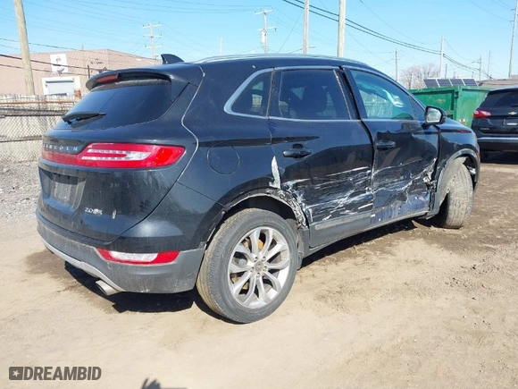 2015 Lincoln MKC with VIN 5LMCJ2A93FUJ42565, listed as a IAAI auction lot 41760265 with 82,812 mi miles. Bid and sale history available at carsss.com. Image 4.