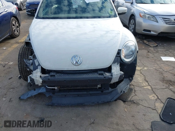 2014 Volkswagen Beetle 2.5L w/Sun with VIN 3VWJP7ATXEM628666, listed as a IAAI auction lot 41328014 with 70,990 mi miles and . Bid and sale history available at DreamBid. Image 6.