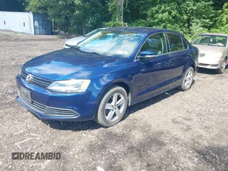 2014 Volkswagen Jetta TDI w/Premium/Nav with VIN 3VWLL7AJ3EM232789, listed as a IAAI auction lot 42737539 with 60,263 mi miles and . Bid and sale history available at DreamBid. Image 2.
