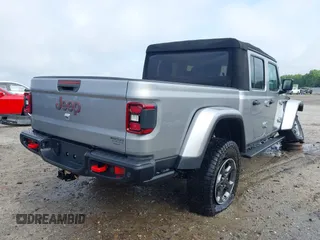 2020 Jeep Gladiator Rubicon z VIN 1C6JJTBG7LL181833, wystawiony jako IAAI lot #42493073 z przebiegiem 13 775 mil mil oraz . Historia ofert i sprzedaży dostępna na DreamBid. Obrazek 4.