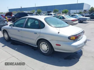 1996 Ford Taurus LX with VIN 1FALP53S5TG199843, listed as a IAAI auction lot 42430761 with 95,984 mi miles and . Bid and sale history available at DreamBid. Image 3.