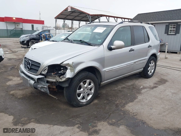 1999 Mercedes-Benz M-Class with VIN 4JGAB72E4XA113675, listed as a IAAI auction lot 41554604 with 230,092 mi miles. Bid and sale history available at carsss.com. Image 2.