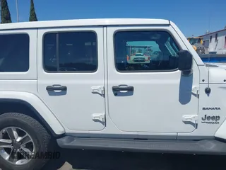 2019 Jeep Wrangler Unlimited Sahara with VIN 1C4HJXENXKW684942, listed as a IAAI auction lot 42021869 with 55,137 mi miles and . Bid and sale history available at DreamBid. Image 13.
