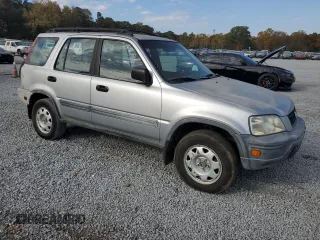 2001 Honda CR-V LX with VIN JHLRD28411S019499, listed as a Copart auction lot 76683944 with 257,124 mi miles and Salvage Title. Bid and sale history available at carsss.com. Image 4.