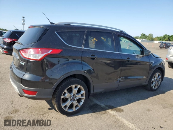 2015 Ford Escape Titanium with VIN 1FMCU0J95FUB59026, listed as a Copart auction lot 65047545 with 84,259 mi miles and Salvage title. Bid and sale history available at DreamBid. Image 3.