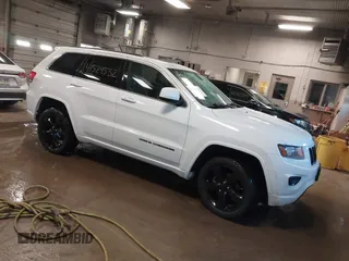 2015 Jeep Grand Cherokee Laredo with VIN 1C4RJFAG4FC660665, listed as a IAAI auction lot 41529532 with 124,099 mi miles. Bid and sale history available at carsss.com. Image 1.
