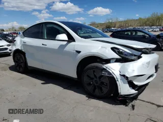 2024 Tesla Model Y Long Range with VIN 7SAYGAEE7RF205700, listed as a Copart auction lot 53814155 with 8,986 mi miles and Salvage Title. Bid and sale history available at DreamBid. Image 4.