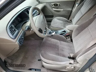 1996 Ford Contour с VIN 3FALP6535TM129390, выставлен на аукционе Copart как лот 73338064 с пробегом 87 588 миль миль и Списание • Salvage title. История ставок и продаж доступна на DreamBid. Изображение 7.