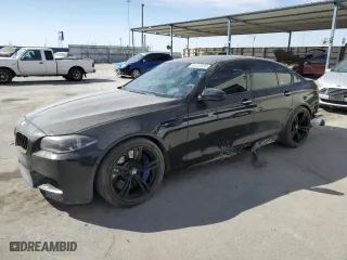 2015 BMW M5 with VIN WBSFV9C5XFD595148, listed as a Copart auction lot 46157335 with 77,582 mi miles and Salvage Title. Bid and sale history available at carsss.com. Image 1.
