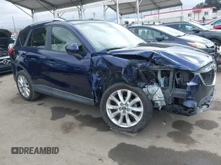 2014 Mazda CX-5 Grand Touring with VIN JM3KE2DY1E0307911, listed as a IAAI auction lot 42064898 with 133,934 mi miles. Bid and sale history available at carsss.com. Image 14.