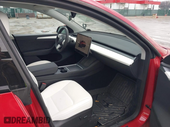 2023 Tesla Model Y Long Range with VIN 7SAYGDEE1PA169031, listed as a IAAI auction lot 41660766 with 35,253 mi miles and . Bid and sale history available at DreamBid. Image 5.