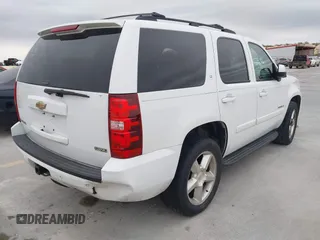 2007 Chevrolet Tahoe LTZ with VIN 1GNFC13027J402178, listed as a IAAI auction lot 41605898 with 203,677 mi miles and . Bid and sale history available at DreamBid. Image 4.
