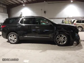 2021 Chevrolet Traverse High Country with VIN 1GNEVNKW9MJ150993, listed as a IAAI auction lot 41224329 with 100,425 mi miles. Bid and sale history available at carsss.com. Image 14.