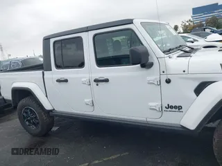 2022 Jeep Gladiator Willys with VIN 1C6HJTAG1NL148524, listed as a IAAI auction lot 41507693 with 42,004 mi miles and . Bid and sale history available at DreamBid. Image 13.