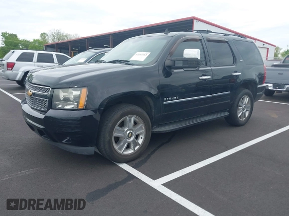 2009 Chevrolet Tahoe LTZ z VIN 1GNFK330X9R130028, wystawiony jako IAAI lot #42113713 z przebiegiem 135 631 mil mil oraz . Historia ofert i sprzedaży dostępna na DreamBid. Obrazek 2.