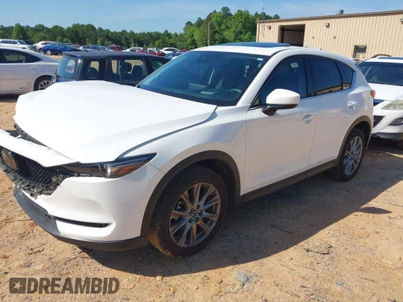 2021 Mazda CX-5 Grand Touring with VIN JM3KFBDM3M0493752, listed as a IAAI auction lot 42456854 with 35,122 mi miles and . Bid and sale history available at DreamBid. Image 21.