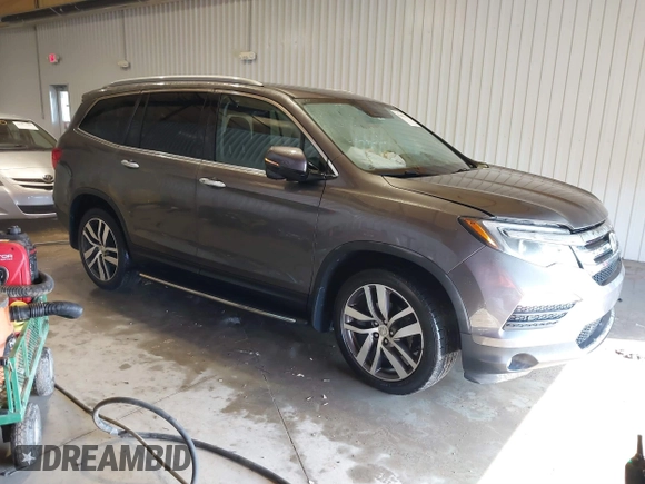 2017 Honda Pilot Touring with VIN 5FNYF6H91HB084737, listed as a IAAI auction lot 41608145 with 86,696 mi miles. Bid and sale history available at carsss.com. Image 1.
