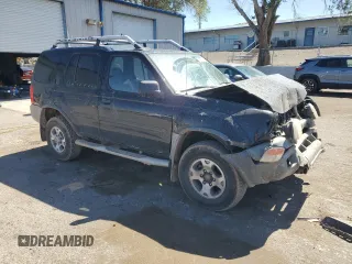 2001 Nissan Xterra XE with VIN 5N1ED28T01C522269, listed as a Copart auction lot 56997515 with 103,800 mi miles and Salvage title. Bid and sale history available at DreamBid. Image 4.