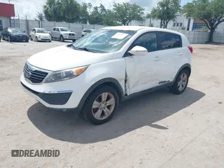 2012 Kia Sportage LX with VIN KNDPB3A2XC7237360, listed as a IAAI auction lot 42478625 with 122,824 mi miles and . Bid and sale history available at DreamBid. Image 2.