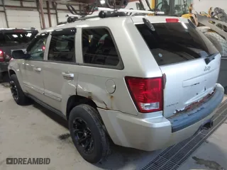 2010 Jeep Grand Cherokee Laredo with VIN 1J4PR4GK9AC160097, listed as a IAAI auction lot 41883264 with 240,409 mi miles. Bid and sale history available at carsss.com. Image 3.