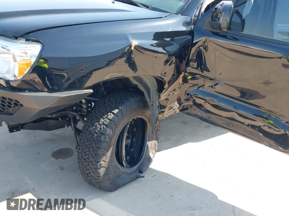 2014 Toyota Tacoma PreRunner with VIN 3TMKU4HN0EM040104, listed as a IAAI auction lot 41619179 with 171,542 mi miles and . Bid and sale history available at DreamBid. Image 6.