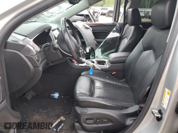 2015 Cadillac SRX Luxury Collection z VIN 3GYFNEE31FS618855, wystawiony jako Copart lot #54868505 z przebiegiem 111 612 mil mil oraz Szkoda całkowita • Salvage title. Historia ofert i sprzedaży dostępna na DreamBid. Obrazek 7.