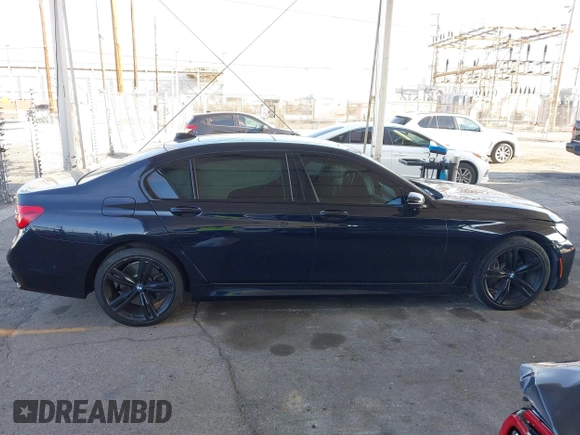 2019 BMW 7 Series 740i with VIN WBA7E2C58KB218419, listed as a IAAI auction lot 41831080 with 97,752 mi miles and . Bid and sale history available at DreamBid. Image 13.