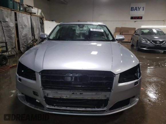 2015 Audi A8 with VIN WAUJGAFD1FN011100, listed as a Copart auction lot 49166055 with 38,575 mi miles and Salvage title. Bid and sale history available at DreamBid. Image 5.
