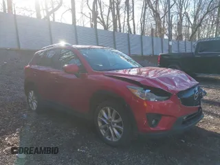 2014 Mazda CX-5 Grand Touring with VIN JM3KE2DY1E0380423, listed as a IAAI auction lot 41854206 with 129,763 mi miles. Bid and sale history available at carsss.com. Image 1.