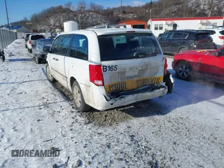 2014 Dodge Grand Caravan American Value with VIN 2C4RDGBG7ER422178, listed as a IAAI auction lot 41352312 with 176,415 mi miles and . Bid and sale history available at DreamBid. Image 3.