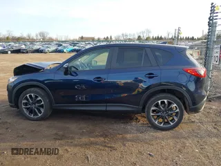 2016 Mazda CX-5 Grand Touring with VIN JM3KE4DY1G0823989, listed as a IAAI auction lot 41770149 with 40,677 mi miles. Bid and sale history available at carsss.com. Image 14.
