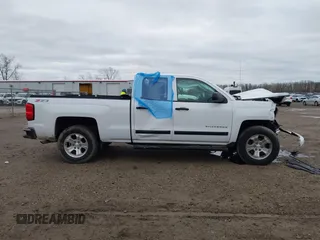 2014 Chevrolet Silverado 1500 LT with VIN 1GCVKREC2EZ390061, listed as a IAAI auction lot 40824477 with 140,928 mi miles and . Bid and sale history available at DreamBid. Image 13.