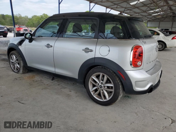 2014 MINI Countryman S with VIN WMWZC3C56EWP29211, listed as a Copart auction lot 52521145 with 91,396 mi miles and Salvage title. Bid and sale history available at DreamBid. Image 2.