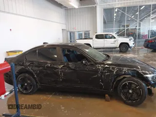 2015 BMW 3 Series 320i xDrive with VIN WBA3C3C56FK203031, listed as a IAAI auction lot 41012182 with 83,611 mi miles and . Bid and sale history available at DreamBid. Image 13.