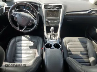 2013 Ford Fusion SE Hybrid z VIN 3FA6P0LU3DR336838, wystawiony jako Copart lot #56205445 z przebiegiem 209 164 mil mil oraz Czysty tytuł • Clean title. Historia ofert i sprzedaży dostępna na DreamBid. Obrazek 8.