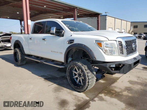 2016 Nissan Titan Platinum Reserve z VIN 1N6BA1F21GN513109, wystawiony jako Copart lot #64840434 z przebiegiem 94 263 mil mil oraz Czysty tytuł • Clean title. Historia ofert i sprzedaży dostępna na DreamBid. Obrazek 4.
