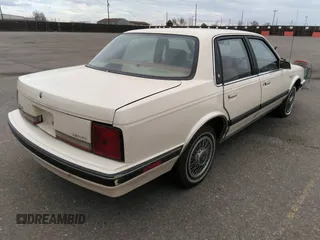 1990 Oldsmobile Cutlass Ciera with VIN 1G3AM54N4L6331841, listed as a IAAI auction lot 41805396 with 145,041 mi miles and . Bid and sale history available at DreamBid. Image 4.