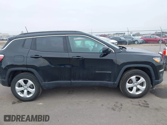 2018 Jeep Compass Altitude with VIN 3C4NJDBB9JT202297, listed as a IAAI auction lot 42020996 with 59,461 mi miles and . Bid and sale history available at DreamBid. Image 13.