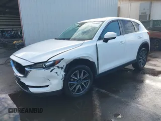 2018 Mazda CX-5 Touring with VIN JM3KFACM1J1431462, listed as a IAAI auction lot 41038099 with 77,489 mi miles. Bid and sale history available at carsss.com. Image 17.