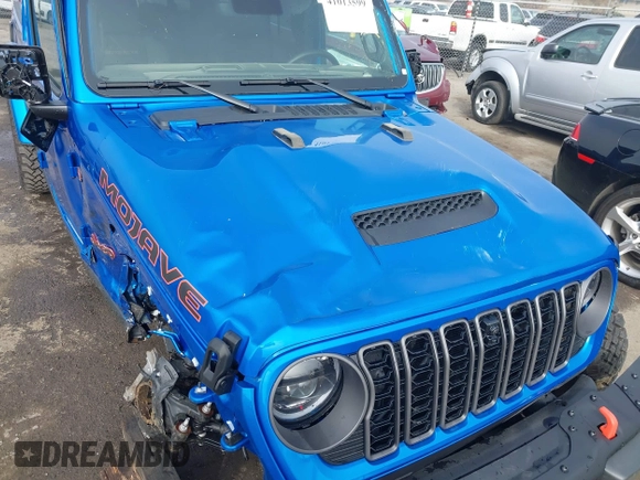 2024 Jeep Gladiator Mojave X z VIN 1C6JJTEG5RL121313, wystawiony jako IAAI lot #41013599 z przebiegiem 2 952 mil mil oraz . Historia ofert i sprzedaży dostępna na DreamBid. Obrazek 19.
