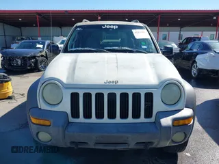 2002 Jeep Liberty Sport with VIN 1J8GL48KX2W153948, listed as a IAAI auction lot 41843882 with 180,677 mi miles. Bid and sale history available at carsss.com. Image 12.