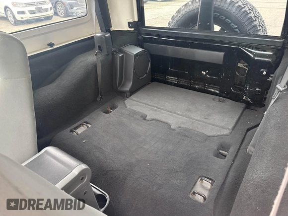 2007 Jeep Wrangler Rubicon with VIN 1J4GA64127L170574, listed as a IAAI auction lot 42474509 with 142,976 mi miles and . Bid and sale history available at DreamBid. Image 8.