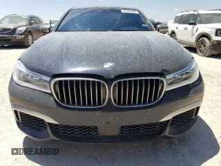2018 BMW 7 Series M760i xDrive with VIN WBA7H6C51JG614580, listed as a Copart auction lot 65748304 with 46,801 mi miles and Clean Title. Bid and sale history available at carsss.com. Image 5.